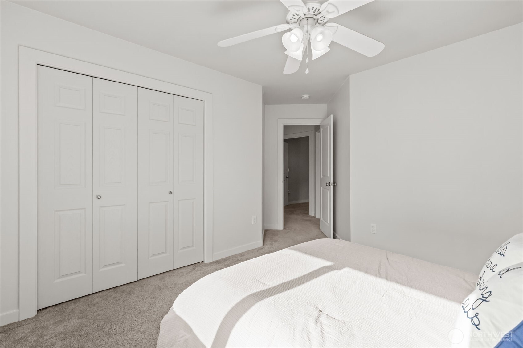 33303 Northeast 42nd Street Carnation, WA 98014 - Photo 32 of 39 a bedroom with a bed and a chandelier