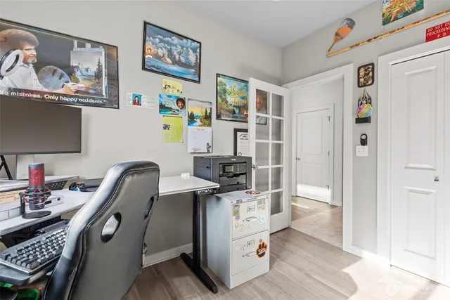 a view of a house with a yard and sitting area