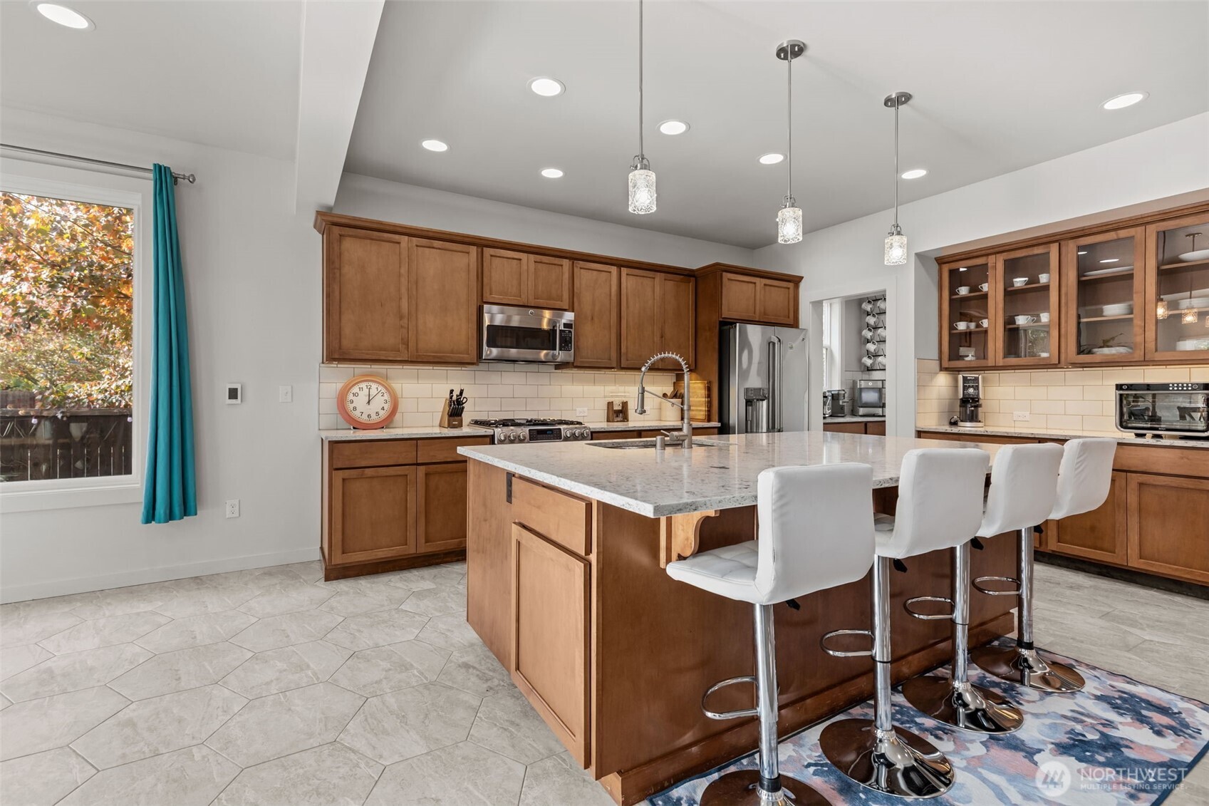 33303 Northeast 42nd Street Carnation, WA 98014 - Photo 7 of 39 a kitchen with stainless steel appliances kitchen island granite countertop a sink and cabinets