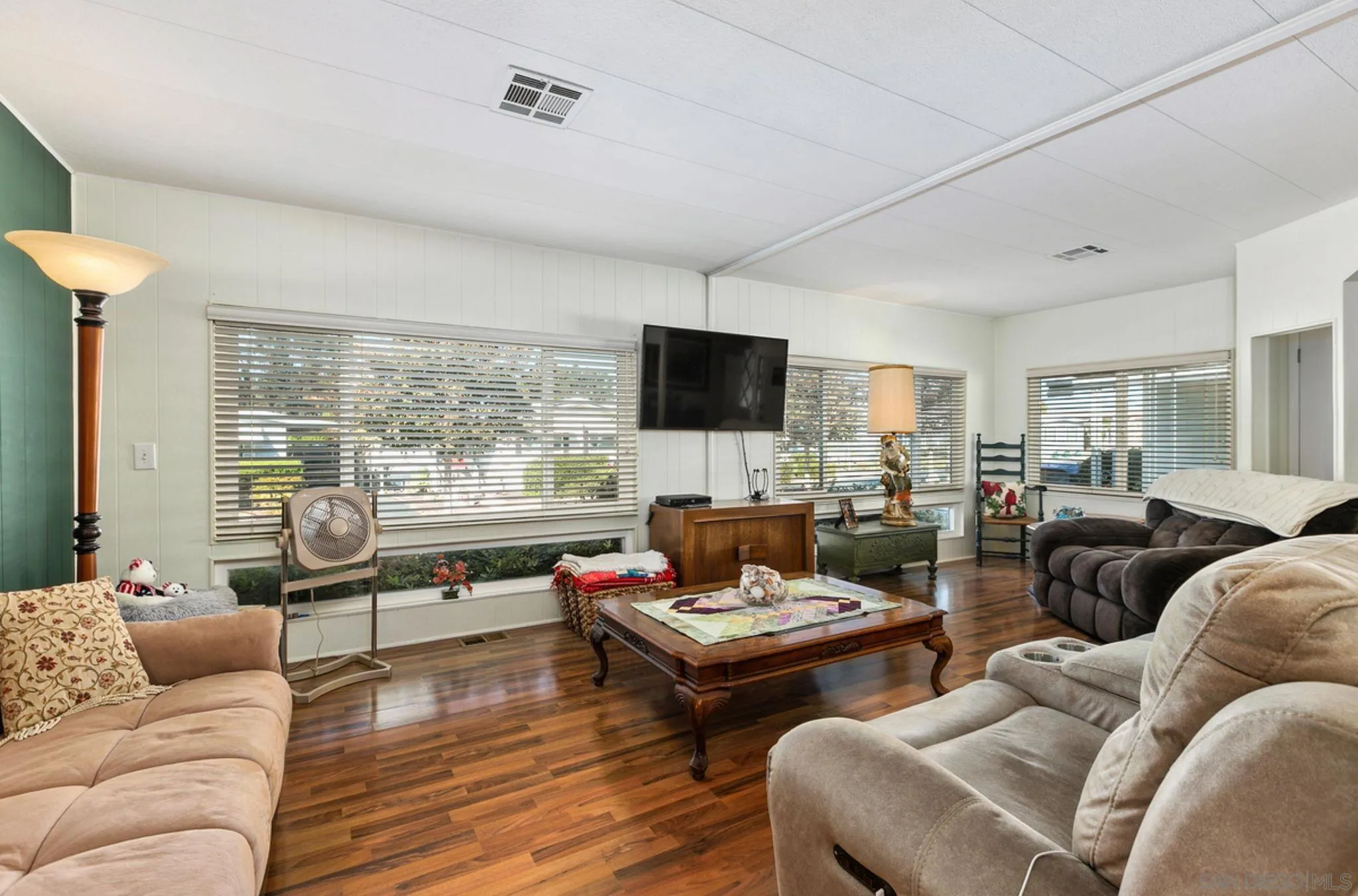 7467 Mission Gorge Road, Unit 6 Santee, CA 92071 - Photo 3 of 14 a living room with furniture and a flat screen tv