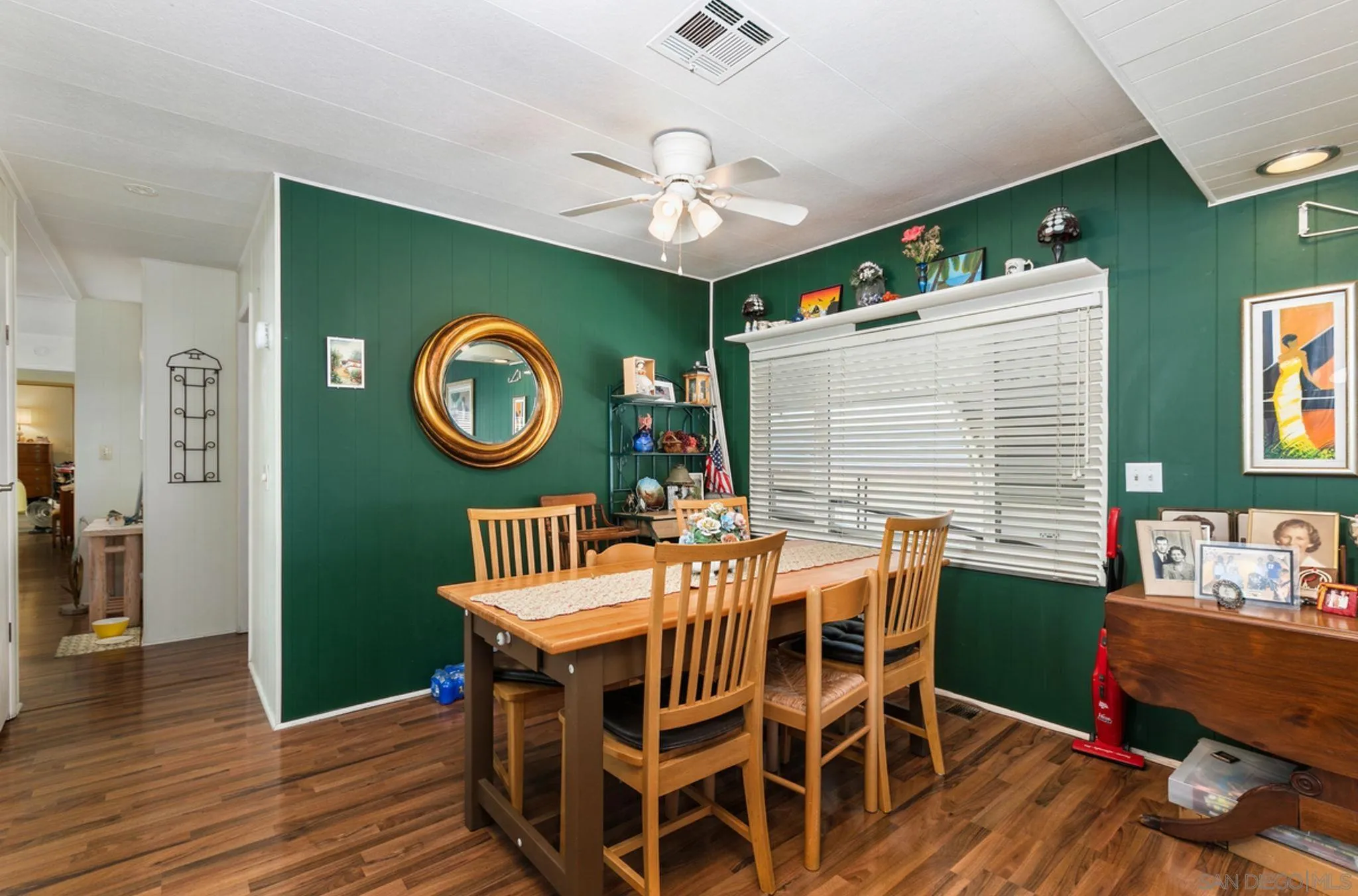 7467 Mission Gorge Road, Unit 6 Santee, CA 92071 - Photo 4 of 14 a view of a dining room with furniture window and wooden floor