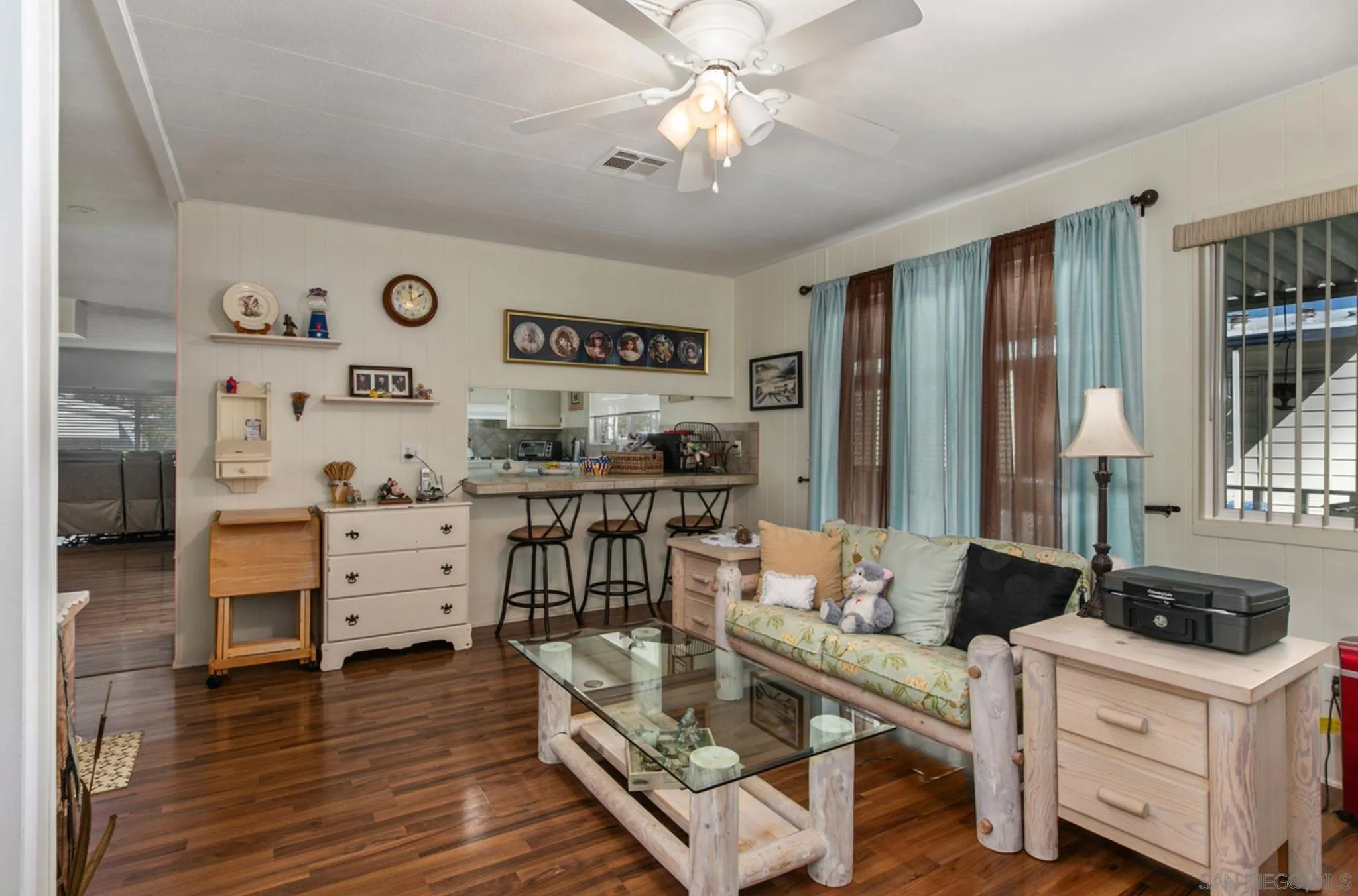 7467 Mission Gorge Road, Unit 6 Santee, CA 92071 - Photo 6 of 14 a living room with furniture and wooden floor