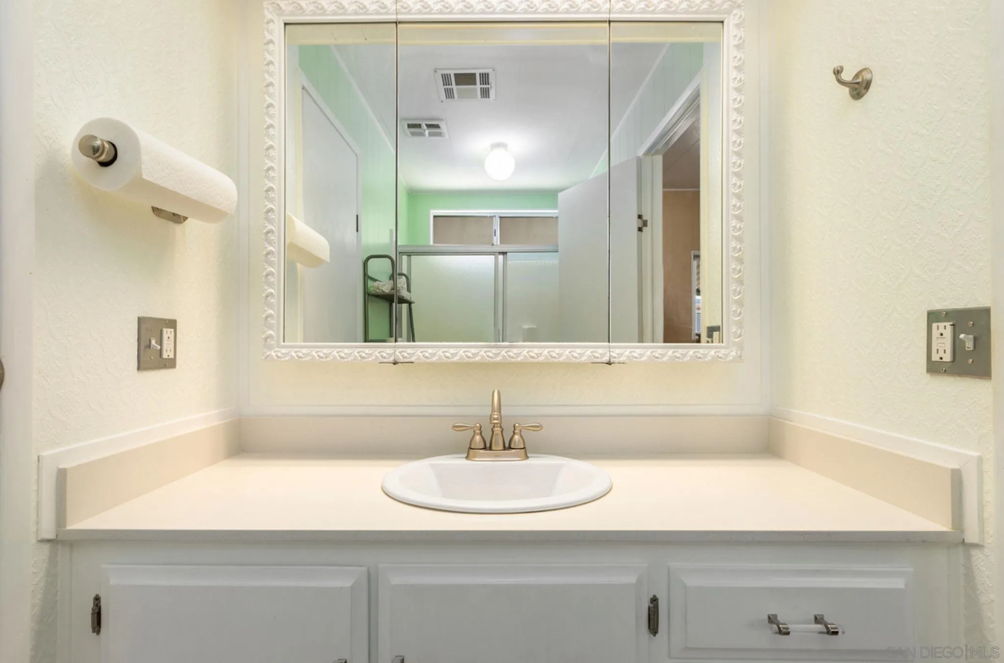 7467 Mission Gorge Road, Unit 6 Santee, CA 92071 - Photo 10 of 14 a bathroom with a sink and a mirror