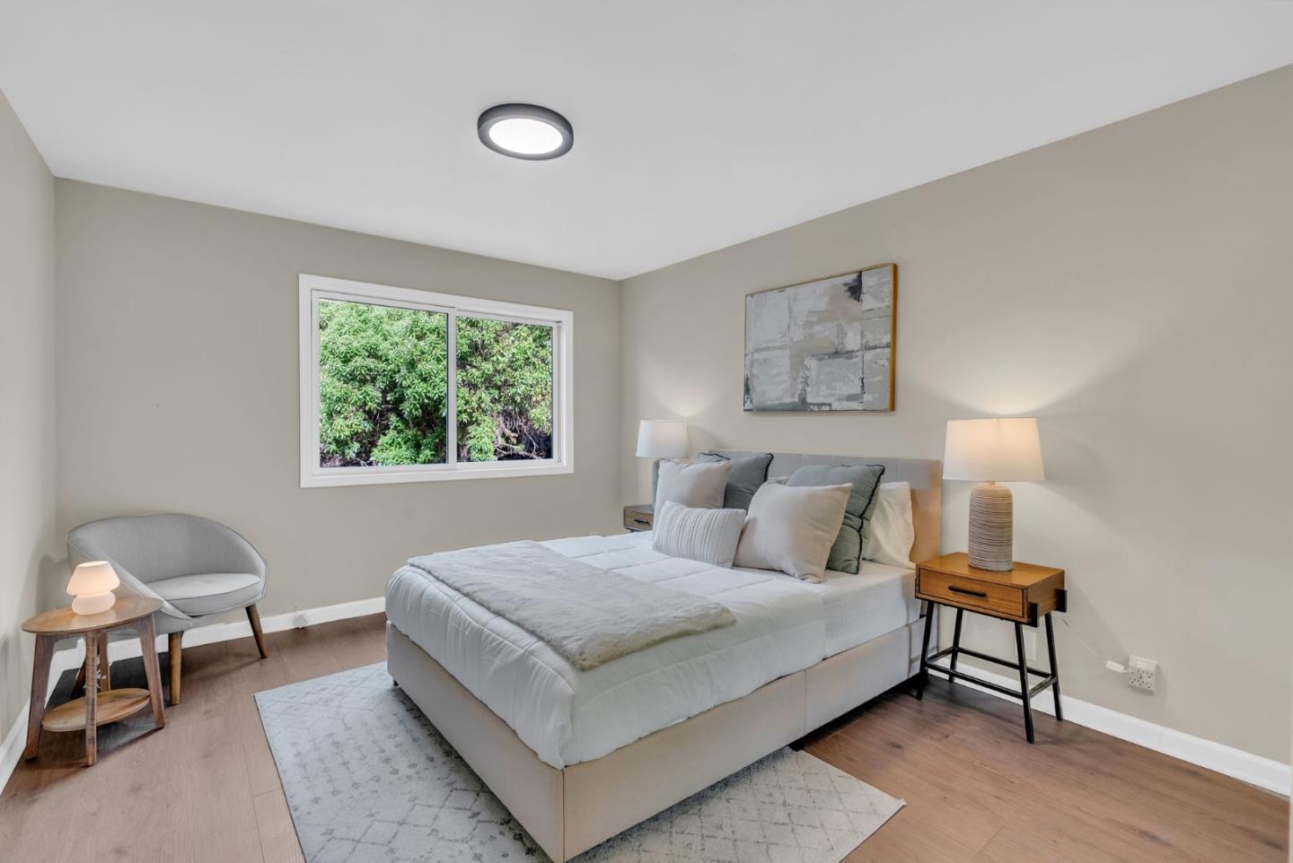 363 Pacific Avenue Pacifica, CA 94044 - Photo 33 of 70 a bedroom with a bed and a lamp