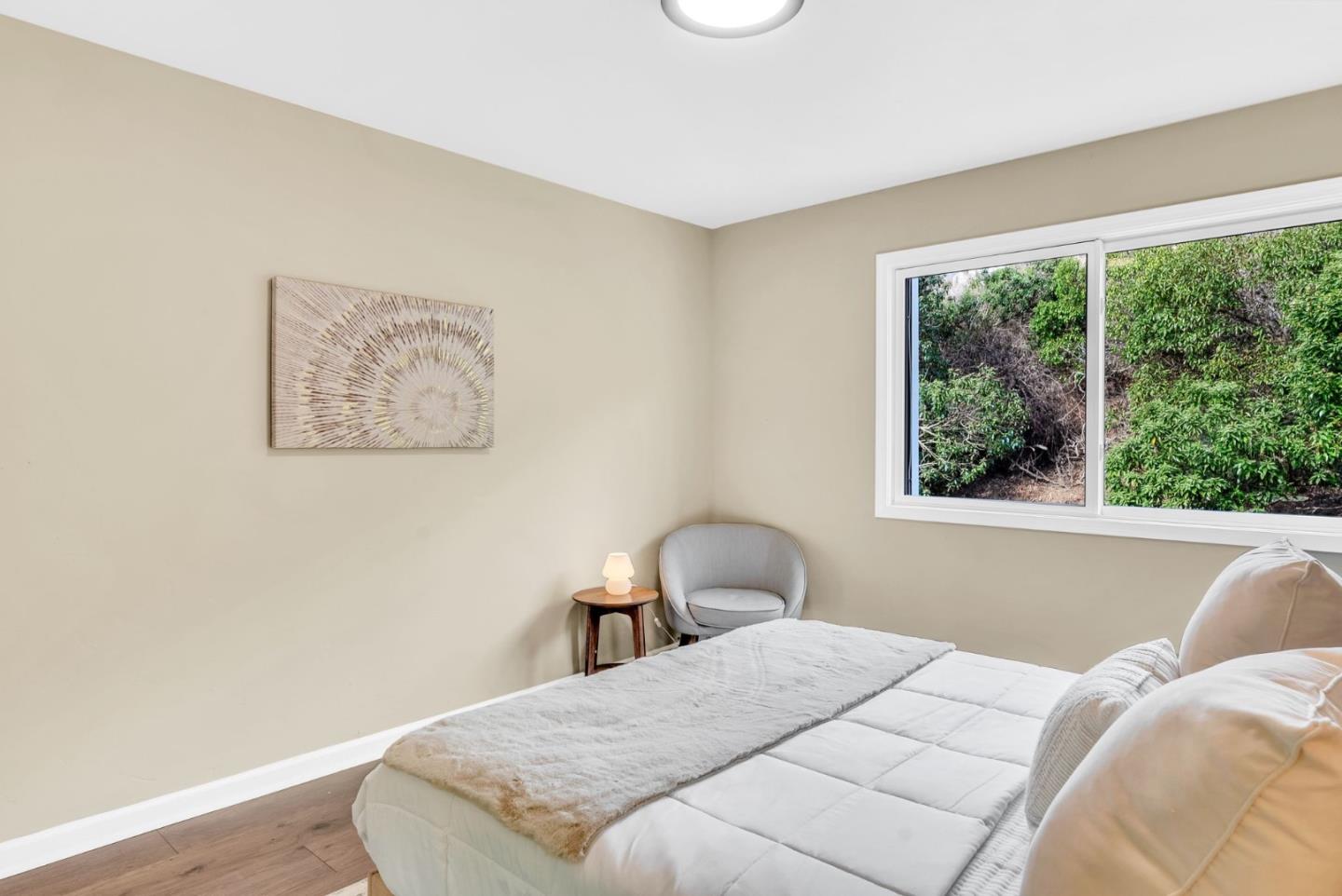 363 Pacific Avenue Pacifica, CA 94044 - Photo 35 of 70 a bedroom with a bed and a large window