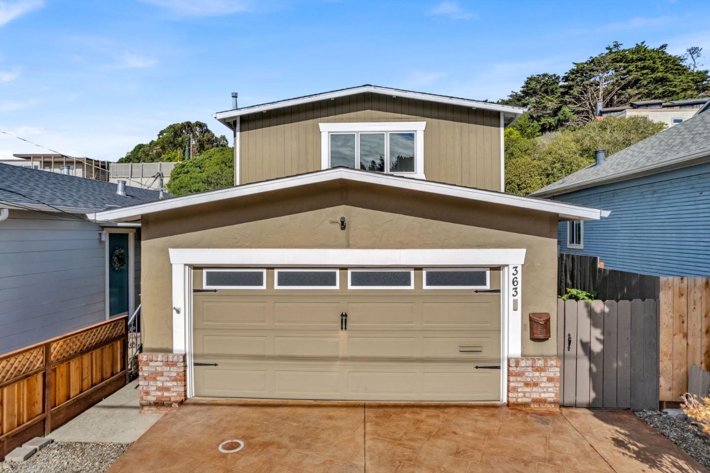 363 Pacific Avenue Pacifica, CA 94044 - Photo 58 of 70 a front view of a house with a garage