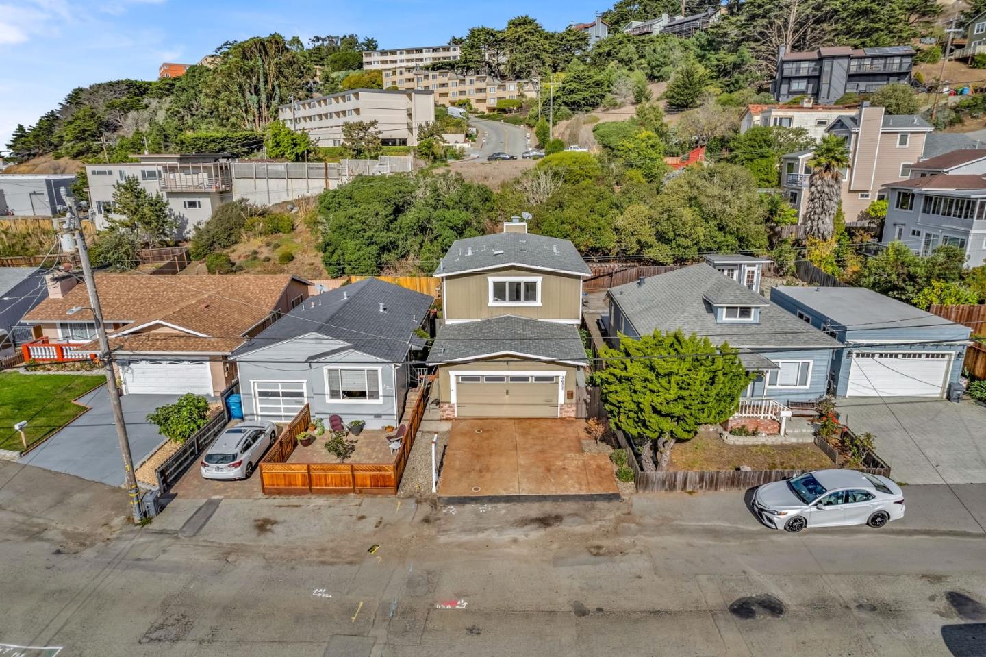 363 Pacific Avenue Pacifica, CA 94044 - Photo 62 of 70 an aerial view of a house with a garden and parking space