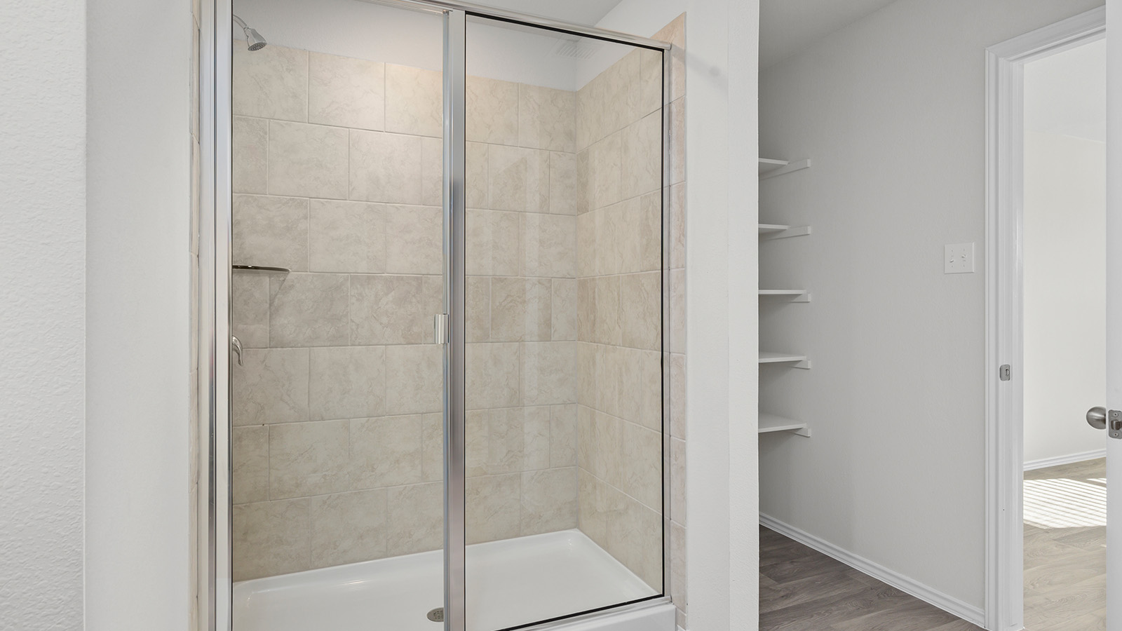 1407 Victory Rnch Trail Killeen, TX 76549 - Photo 15 of 24 A clean, modern walk-in shower features tiled walls and a sleek glass enclosure.