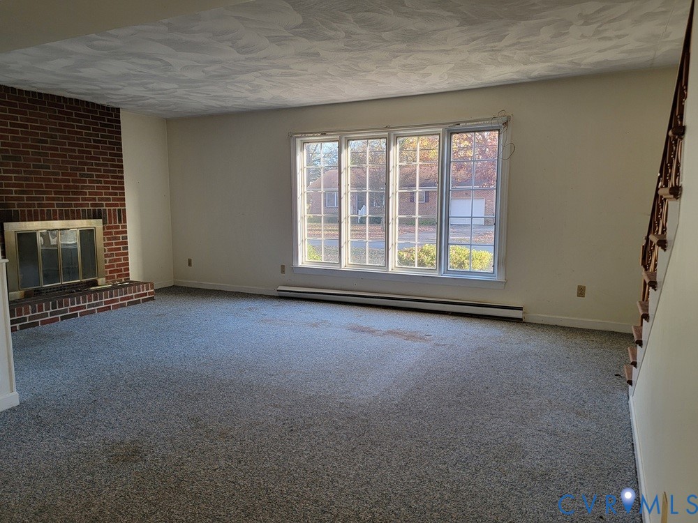 515 18th Street West Point, VA 23181 - Photo 4 of 23 an empty room with a fireplace