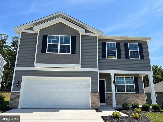 a front view of a house with garage