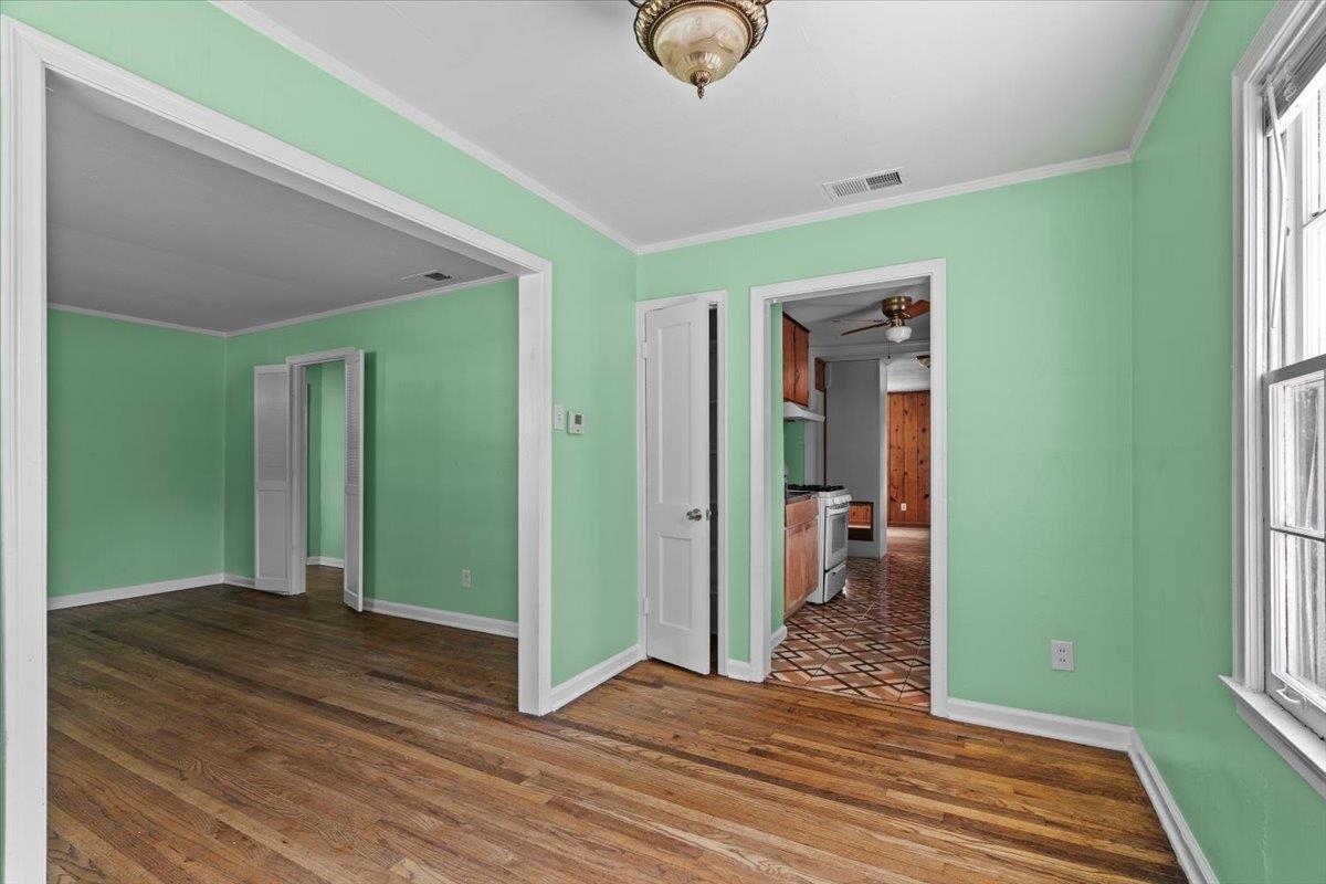 3801 Wilshire Road Memphis, TN 38111 - Photo 5 of 19 Unfurnished bedroom featuring ornamental molding and dark wood-style floors