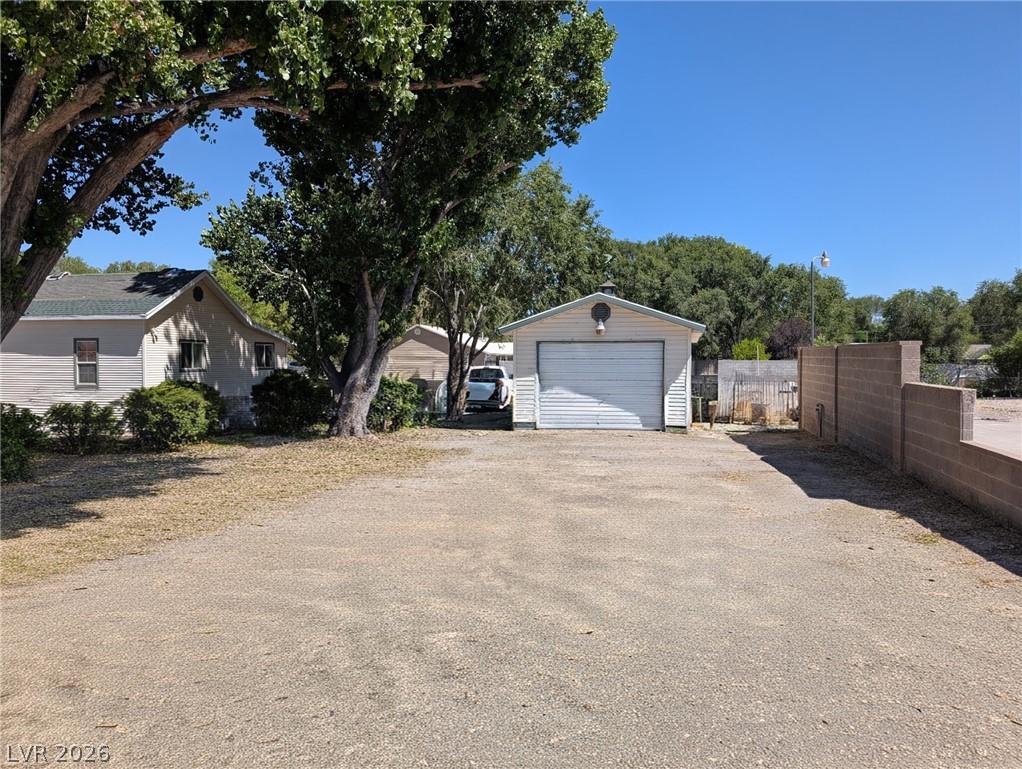 997 Phillips Street Panaca, NV 89042 - Photo 4 of 19 A detached garage/casita with a wide driveway provides ample parking space.