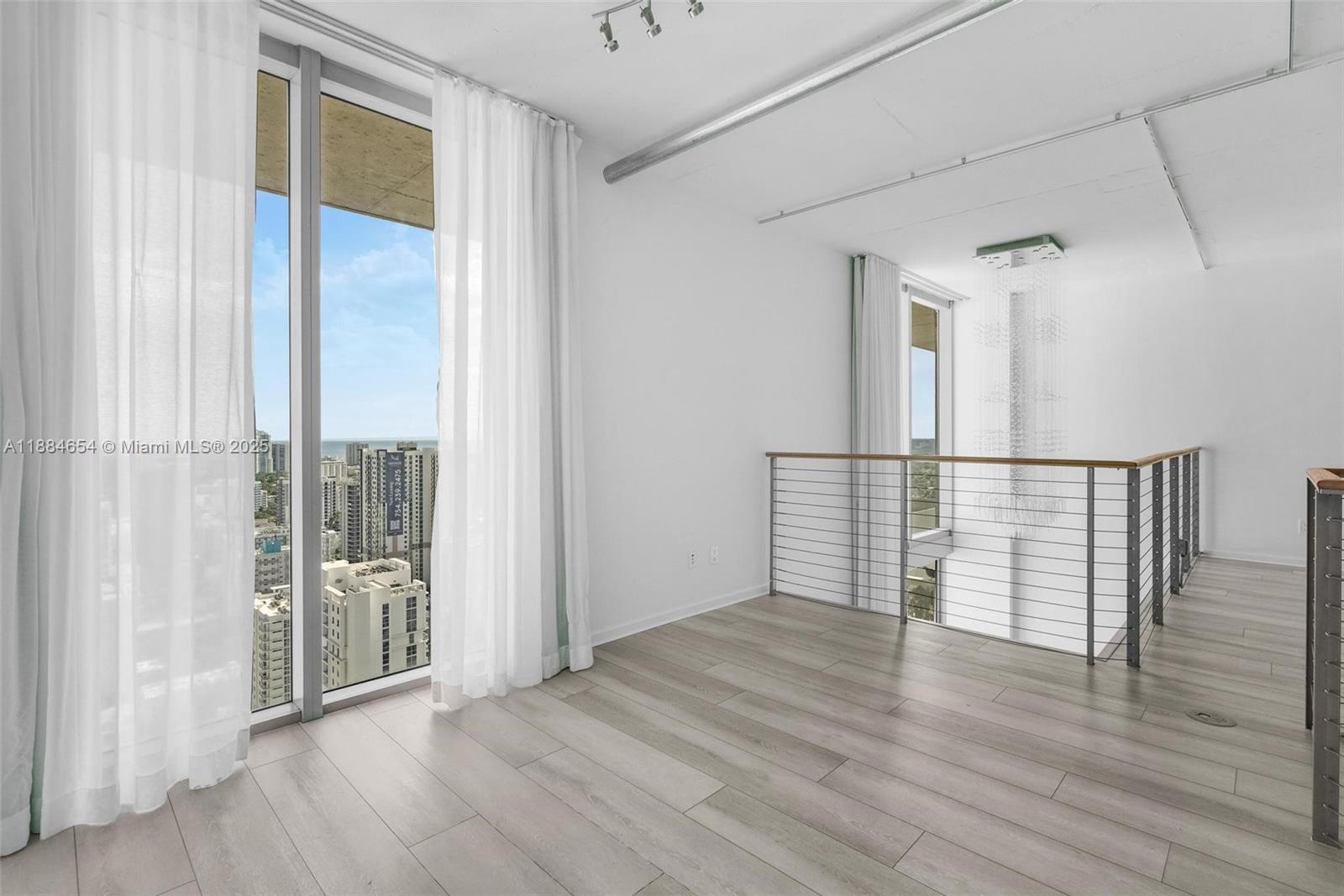 690 Southwest 1st Court, Unit PHII 19 Miami, FL 33130 - Photo 27 of 45 a view of entryway with wooden floor