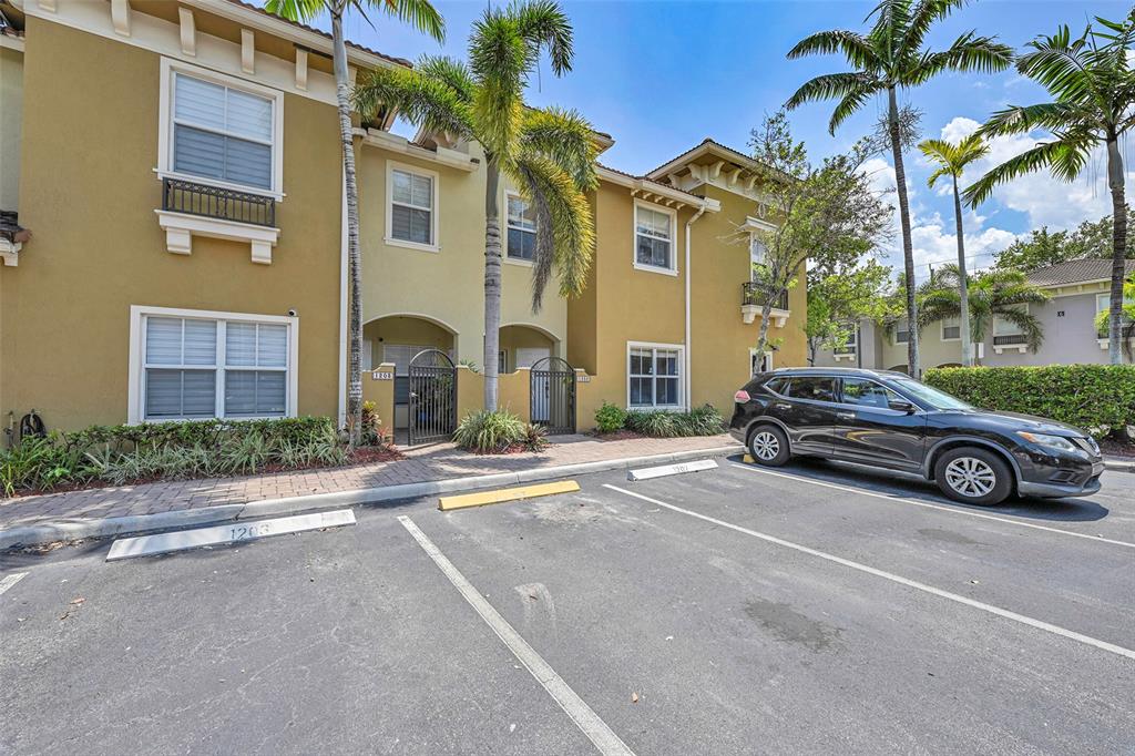 2851 Prospect Road, Unit 1202 Tamarac, FL 33309 - Photo 4 of 25 1 assigned and plenty of extra guest parking.