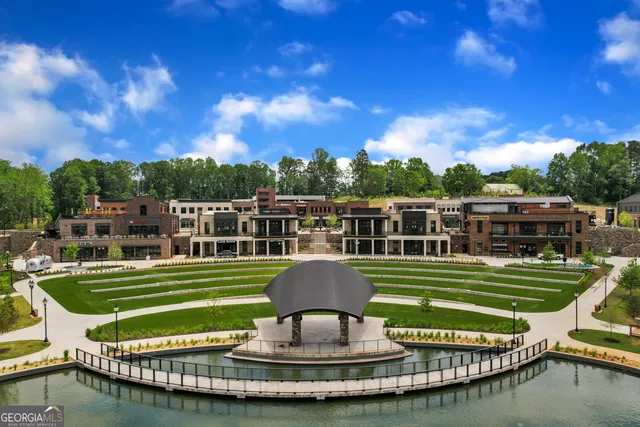 a front view of a house with a yard table and chairs