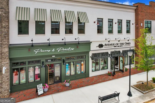 a view of a table and chairs in the garden