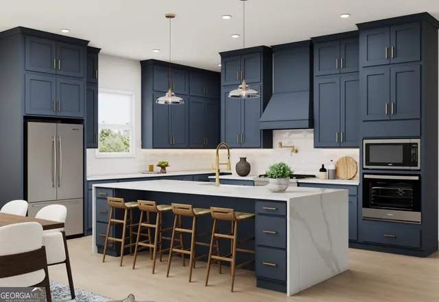 a kitchen with a table chairs sink and cabinets
