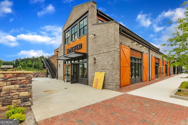 a front view of a building with yellow lighting