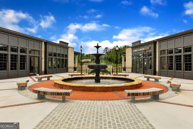 a table and chairs in front of building