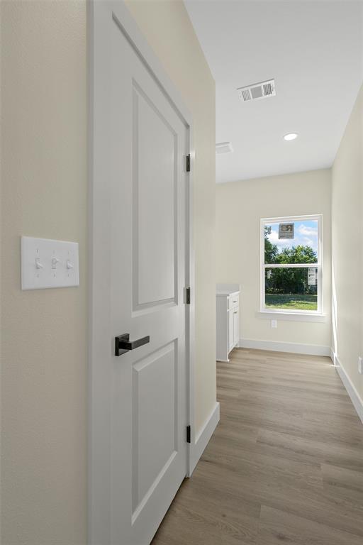 3320 North 27th Street Waco, TX 76708 - Photo 15 of 38 a view of a hallway with wooden floor and front door