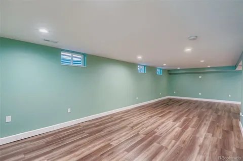 an empty room with wooden floor