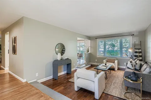 a living room with furniture rug and window