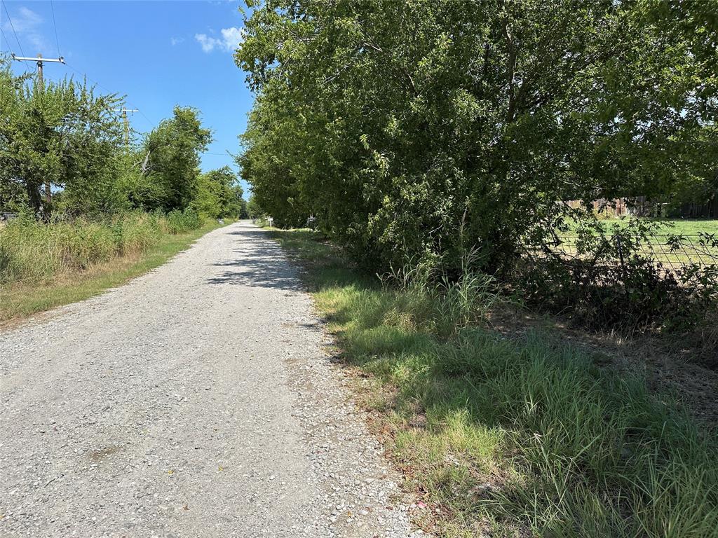 219 Hubbard Road Sunset, TX 76270 - Photo 14 of 18 a view of a road with a yard
