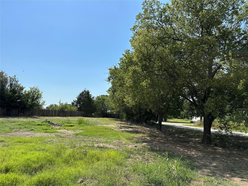 219 Hubbard Road Sunset, TX 76270 - Photo 3 of 18 a view of outdoor space with trees all around