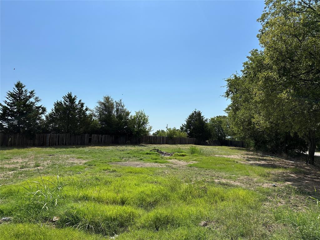 219 Hubbard Road Sunset, TX 76270 - Photo 4 of 18 a view of outdoor space with a garden and trees