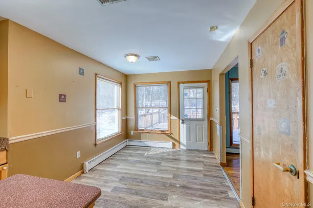 a view of empty room with a fan