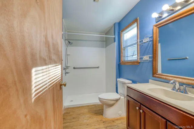 a view of a big room with closet and a ceiling fan