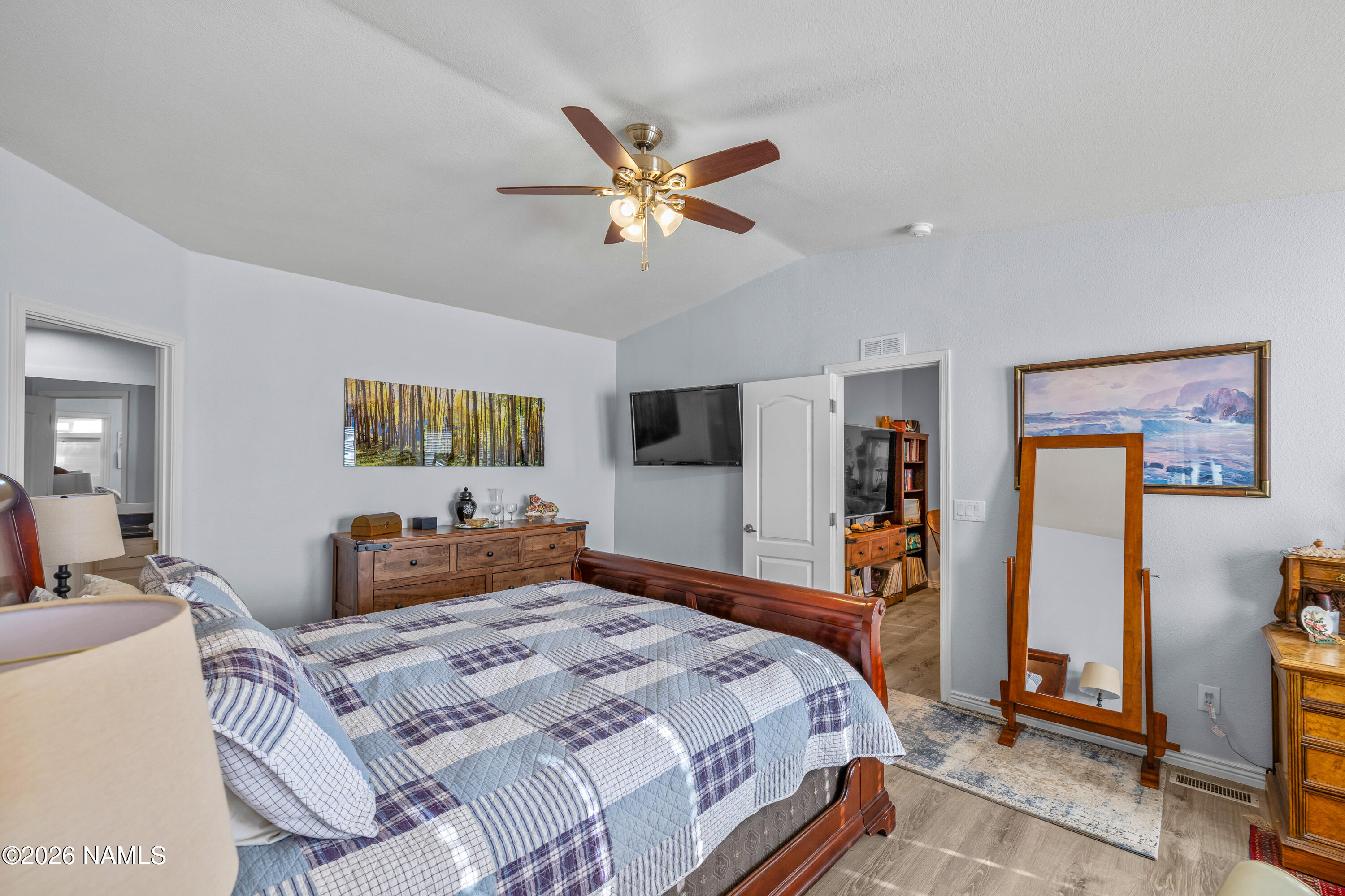 1150 North Three Bears Loop Parks, AZ 86018 - Photo 19 of 82 a bedroom with a bed and a flat screen tv