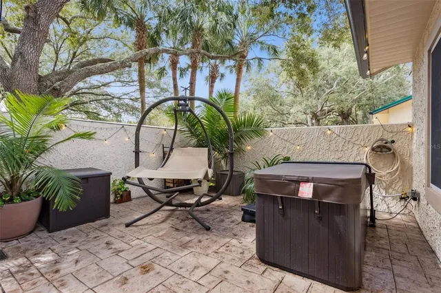 a view of a backyard with sitting area