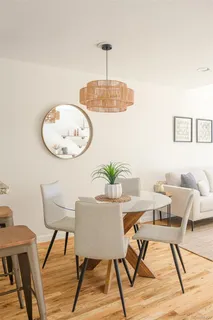 a view of a dining room with furniture and wooden floor