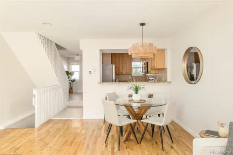 a view of a dining room with furniture window and wooden floor