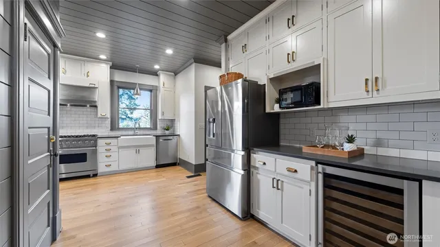 a living room with fireplace furniture and a chandelier