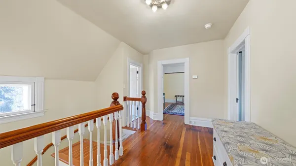 a bedroom with a bed and a chair