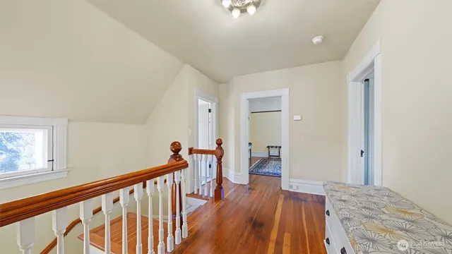 a bedroom with a bed and a chair