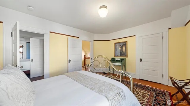 a bedroom with a bed and cabinets