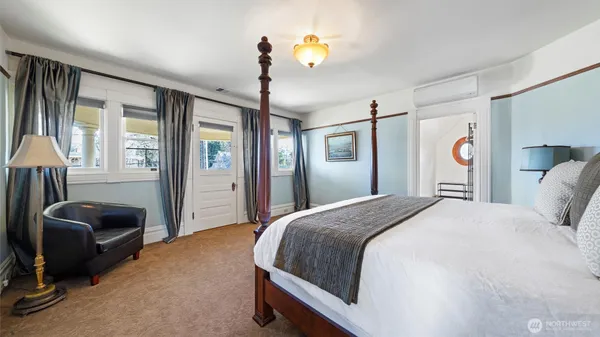 a bedroom with furniture and a window