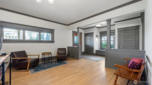 a view of a dining room with furniture wooden floor and chandelier