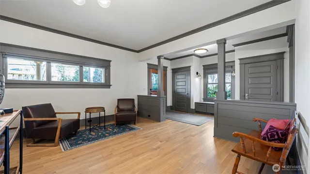 a view of a dining room with furniture wooden floor and chandelier