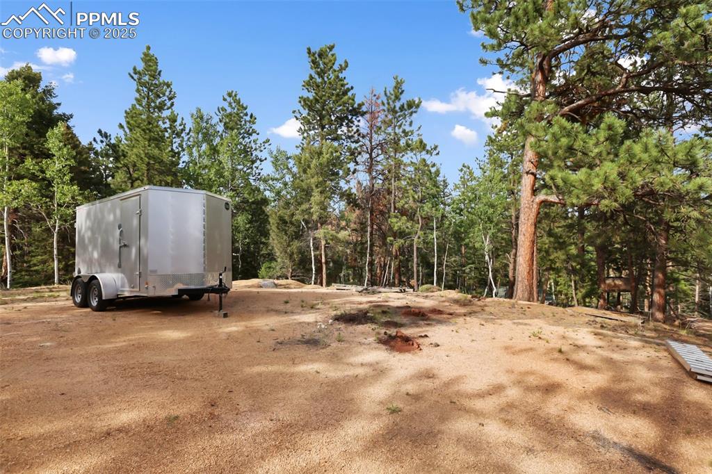 410 Rangeview Road Divide, CO 80814 - Photo 20 of 23 a view of a house with a yard and covered with snow