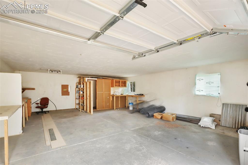 410 Rangeview Road Divide, CO 80814 - Photo 23 of 23 a view of a livingroom with furniture and a garage