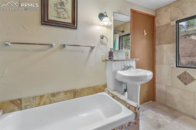 a bathroom with a sink and a bathtub