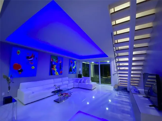 a room with furniture and pool view