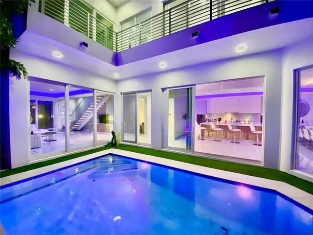 a view of swimming pool from a balcony