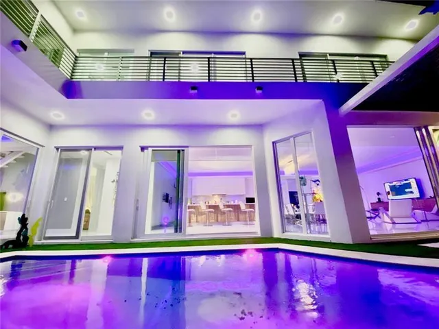 a view of an chairs and table in the room