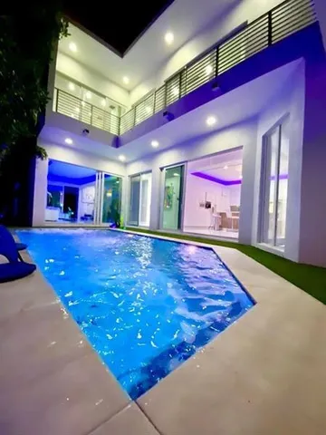 a bedroom with wooden floor and furniture