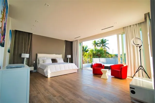 a bathroom with a sink mirror and a shower